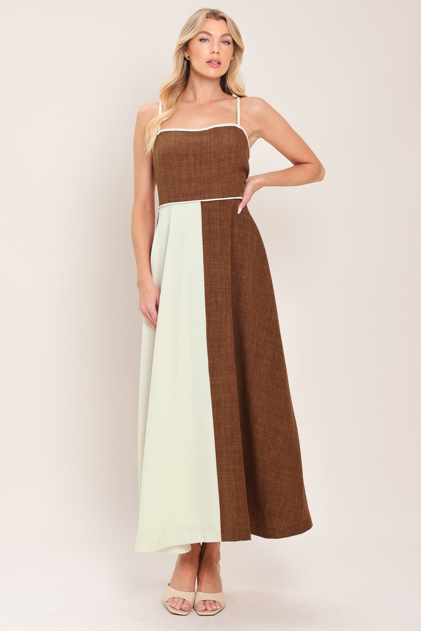Woman wearing a two-tone dress with brown and white colors | Flying Tomato