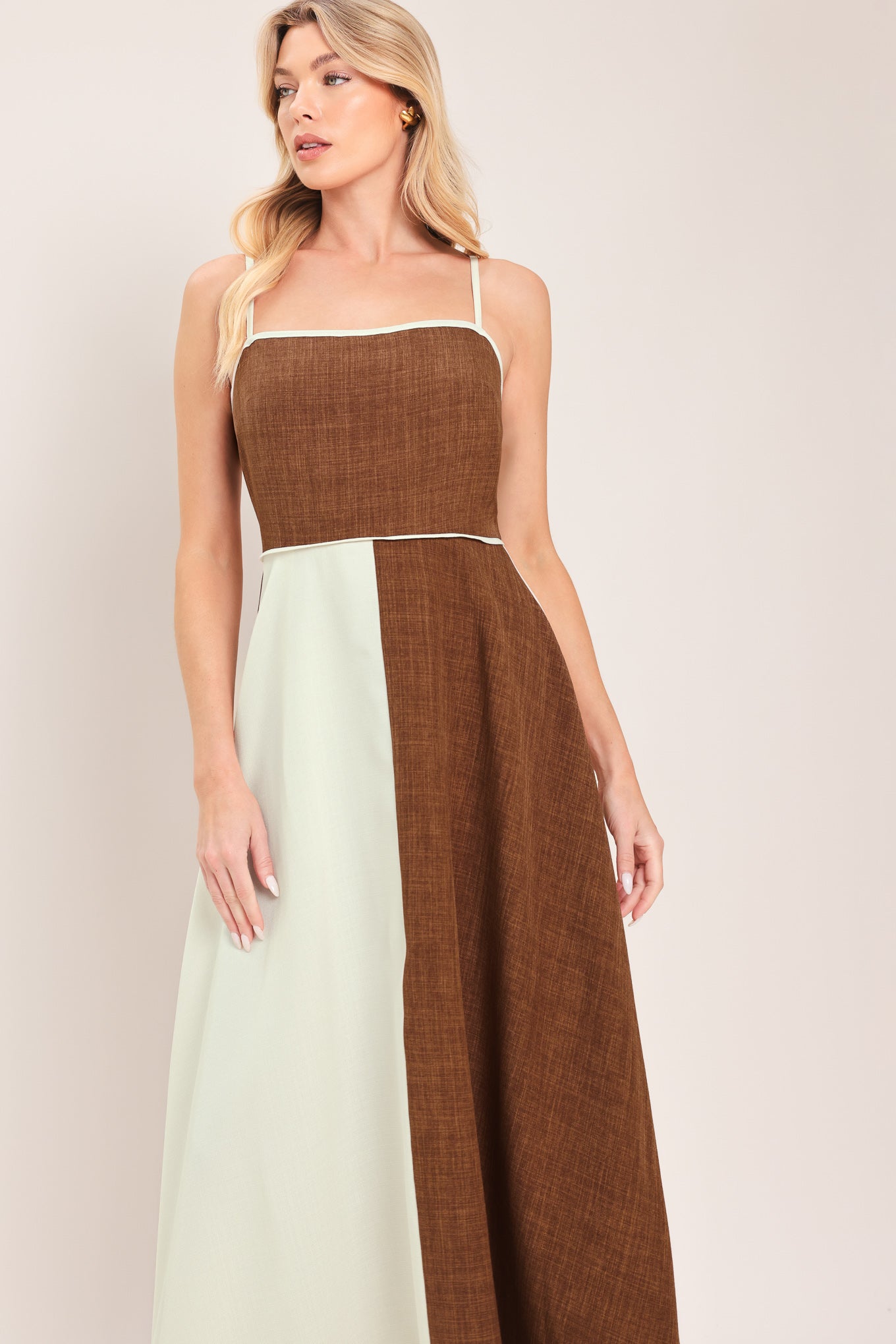 Woman wearing a two-tone dress with brown and white colors | Flying Tomato
