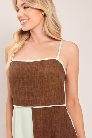 Woman wearing a two-tone dress with brown and white colors | Flying Tomato