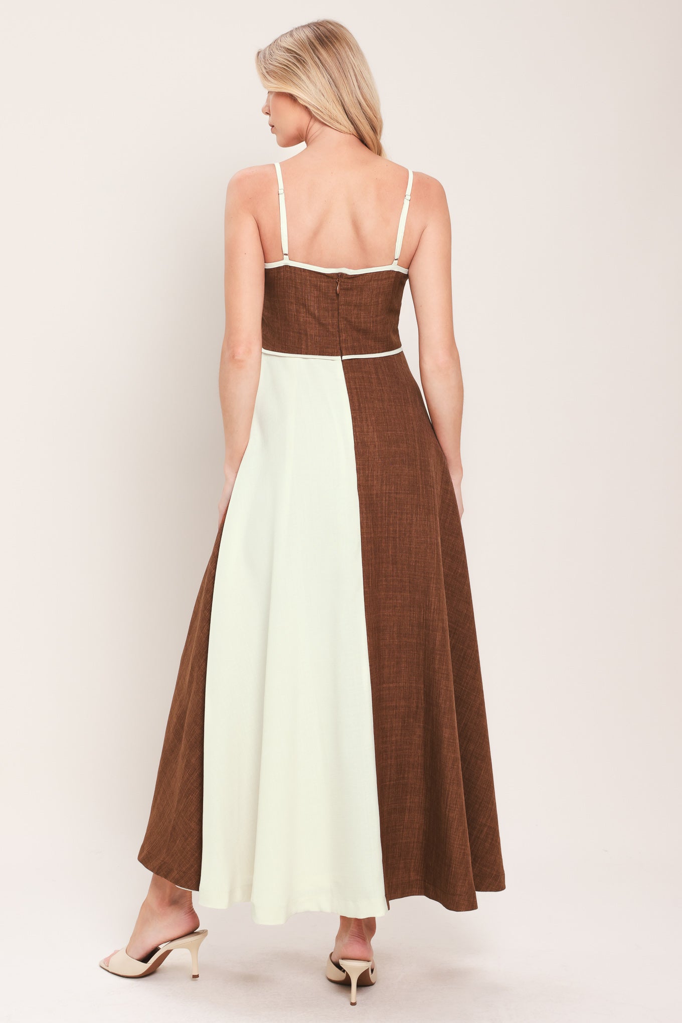 Woman wearing a two-tone dress with brown and white colors | Flying Tomato