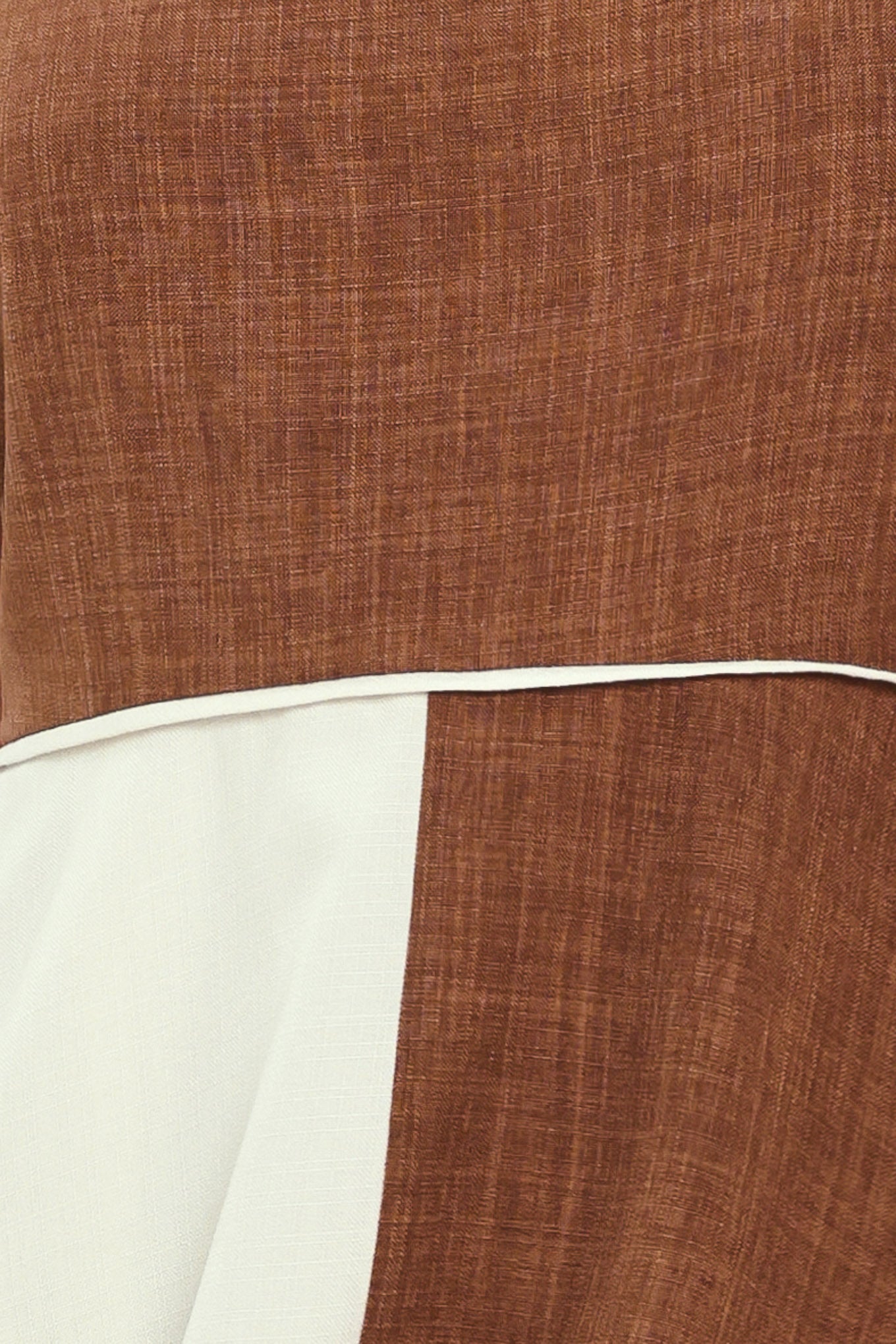 Close-up of brown and white fabric | Flying Tomato