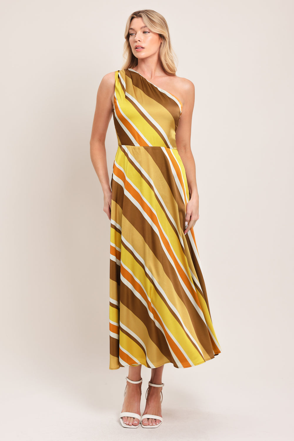 Woman wearing a one-shoulder striped midi dress featuring a side zipper and full circle skirt | Flying Tomato