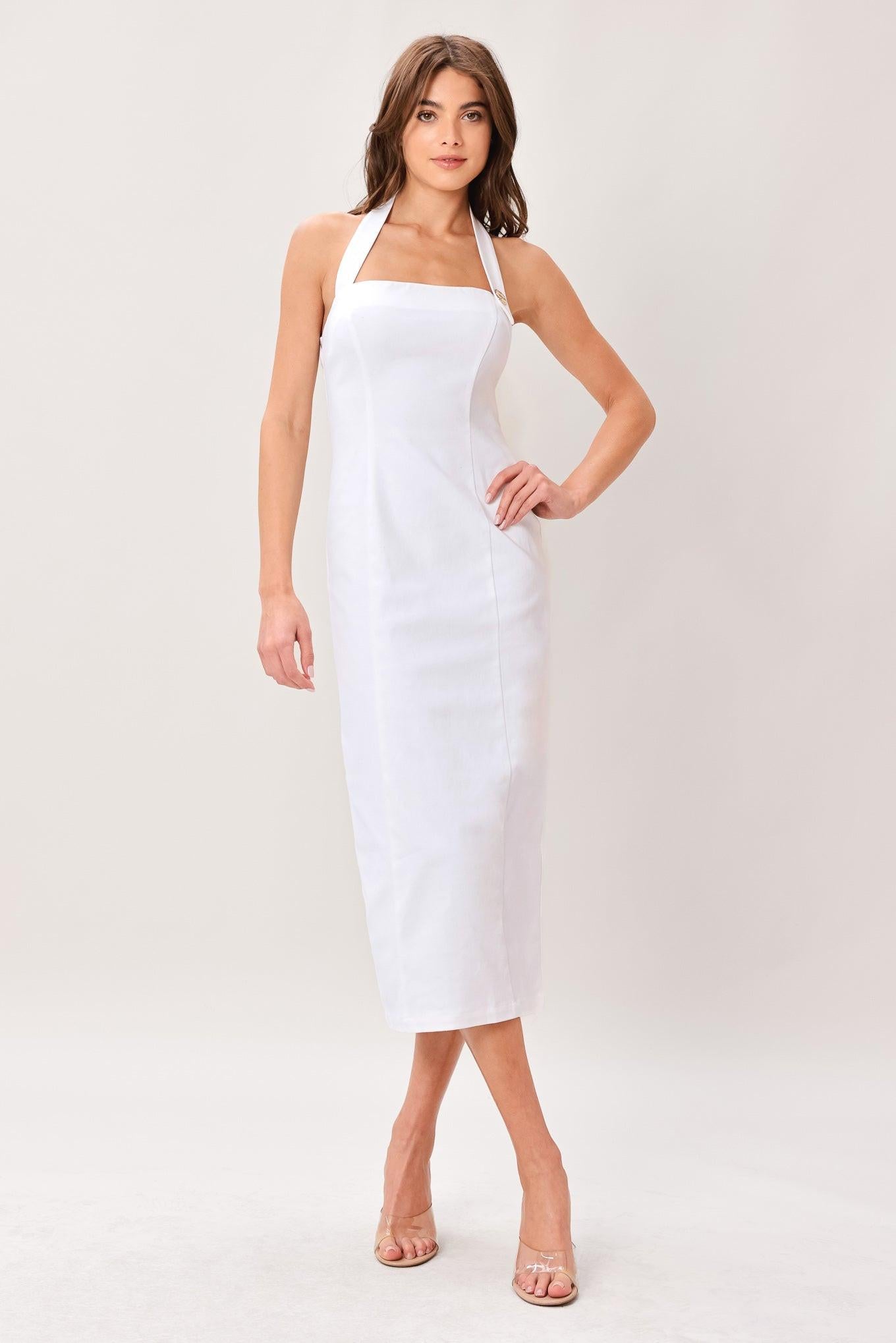 Woman wearing a white solid woven midi dress featuring straight neckline with halter strap and button, pencil skirt and back zipper closure