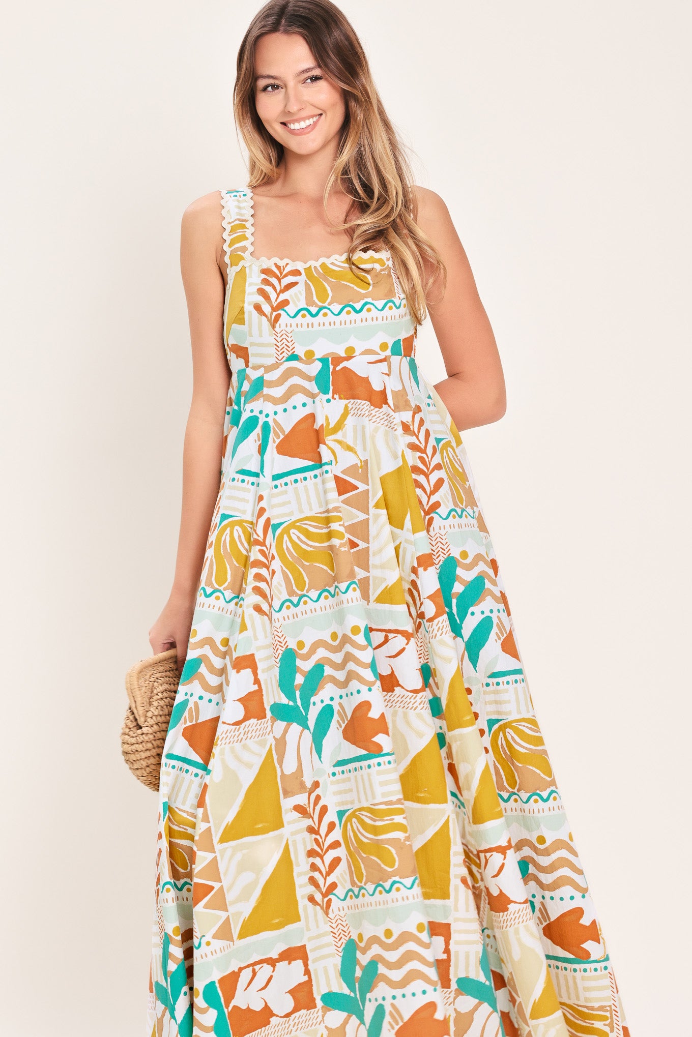 Woman wearing a printed woven midi dress featuring straight neckline with ric-rac ribbon trim, circle skirt and smocked back bodice | Flying Tomato