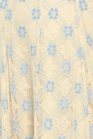 Close up of a yellow with blue floral lace midi dress | Flying Tomato