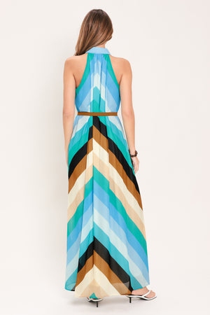 Woman wearing a sleeveless multicolor blue, teal, and brown striped maxi dress featuring halter neckline with collared finish, contrasting belt, and front button down | Flying Tomato