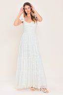 Woman wearing a white maxi dress featuring sweetheart neckline, ruffle sleeve, tier skirt and smocked back bodice  | FREEMARKET