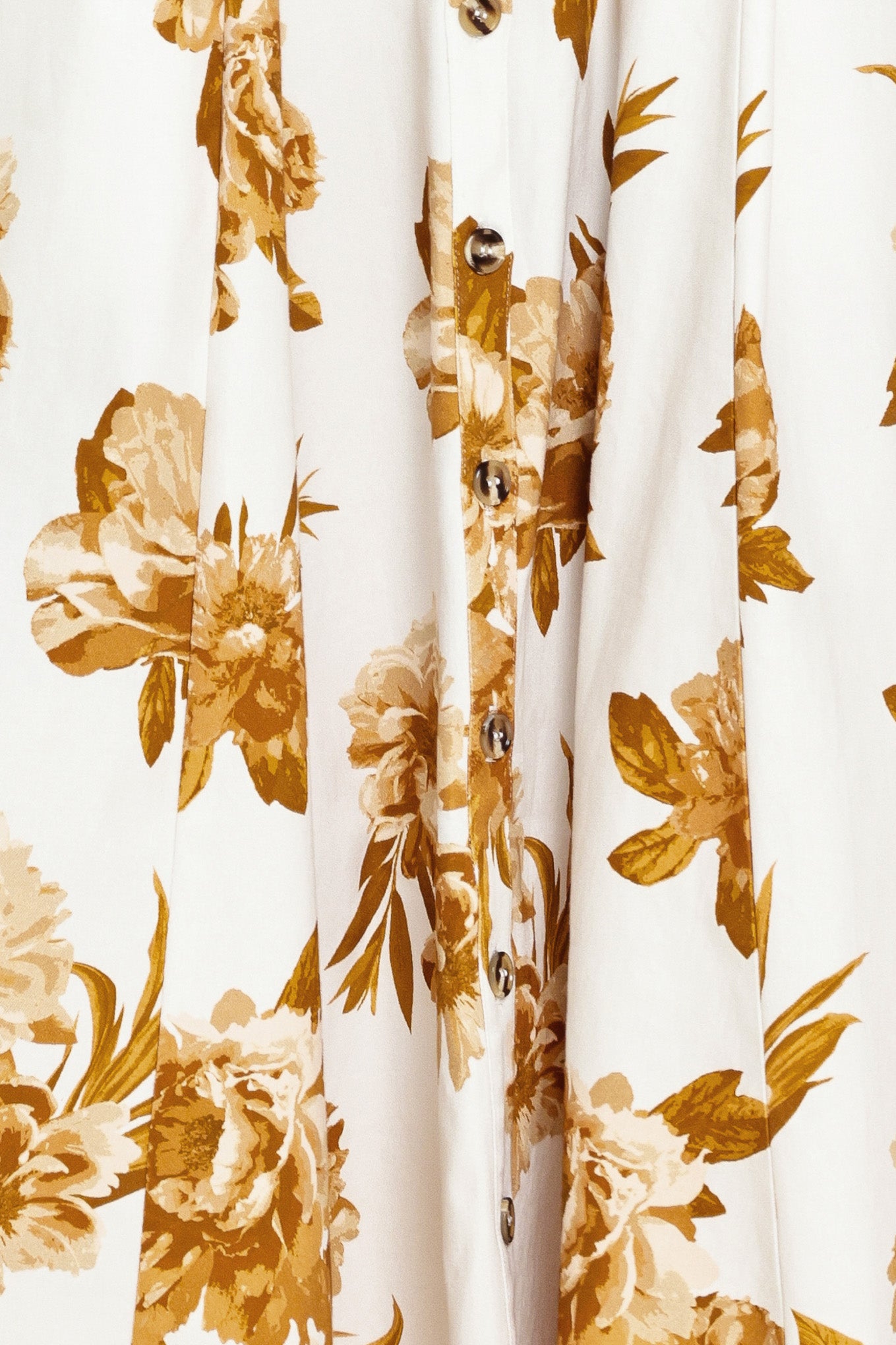 Woman wearing a sleeveless ivory midi dress with brown floral print featuring collar, front button down, contrasting belt and circle skirt | Flying Tomato