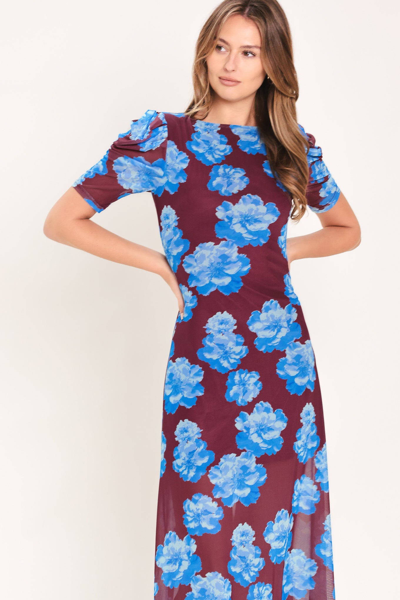 Woman wearing a wine power mesh midi dress with blue flowers | Flying Tomato
