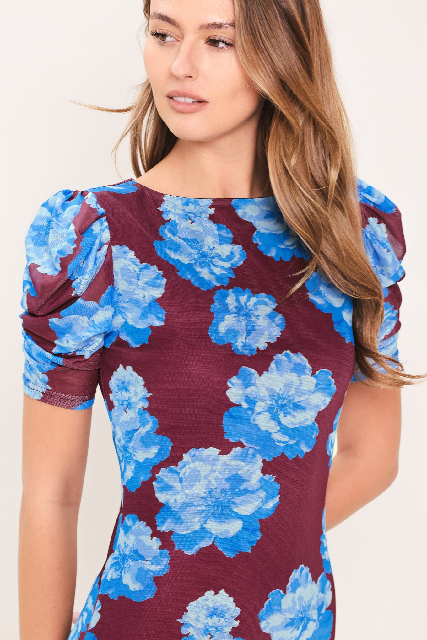 Woman wearing a wine power mesh midi dress with blue flowers | Flying Tomato