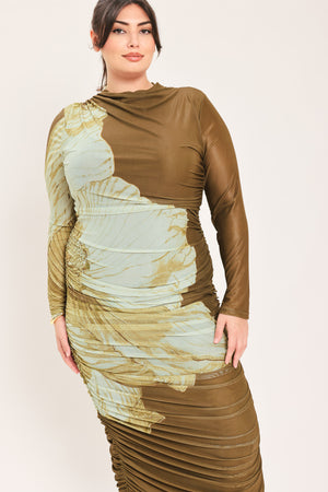 A woman models a long-sleeve midi dress with a brown base and a large beige floral print | Flying Tomato Curve