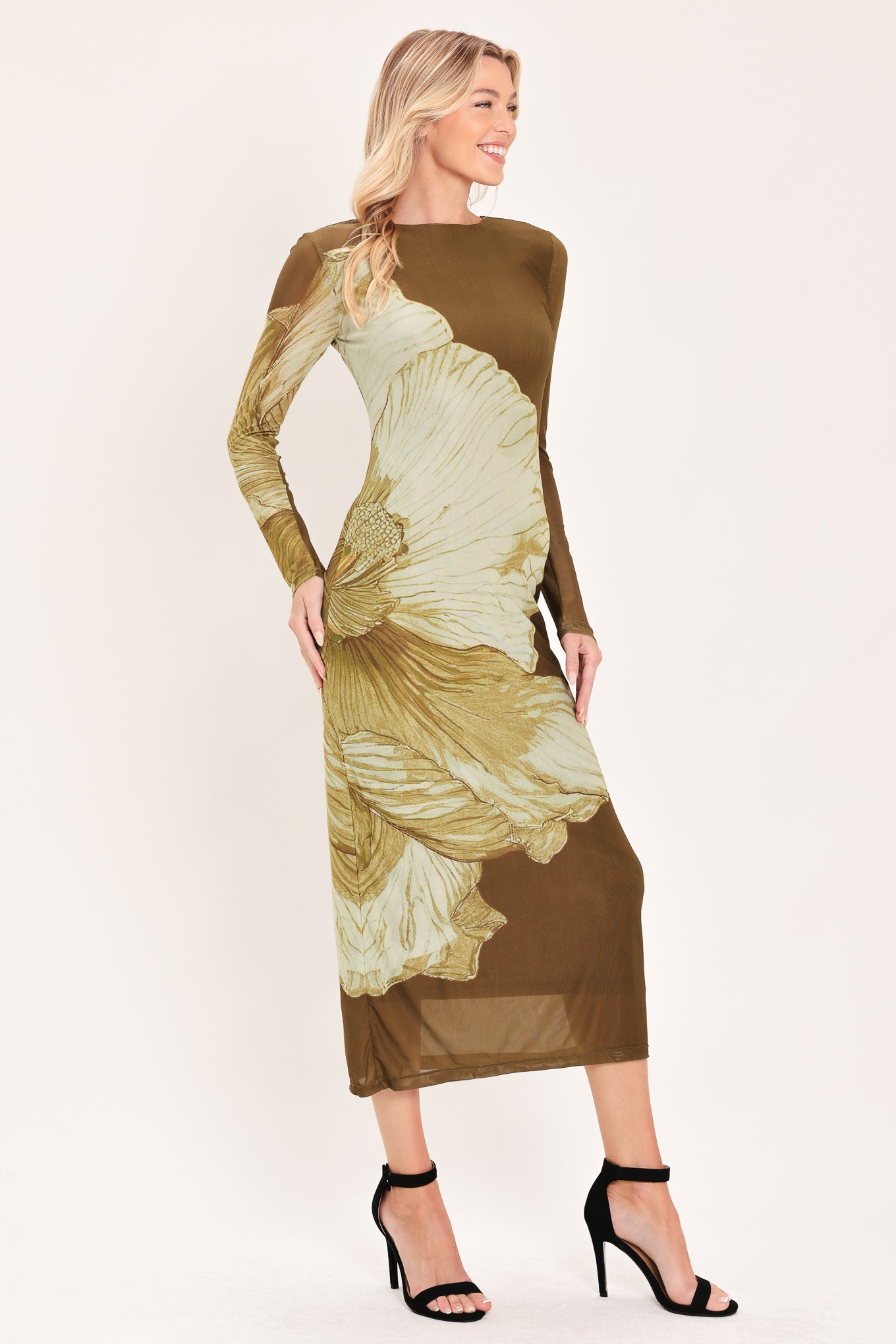 A woman models a long-sleeve midi dress with a brown base and a large beige floral print | Flying Tomato
