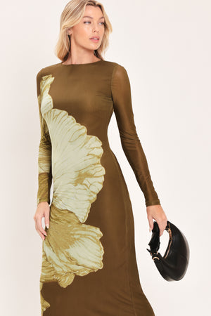 A woman models a long-sleeve midi dress with a brown base and a large beige floral print | Flying Tomato