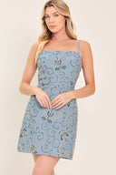 Woman wearing a blue embroidered mini dress with back zipper | Flying Tomato