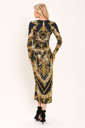Woman wearing a black and gold baroque printed power mesh midi dress with long sleeve and back neck button | Flying Tomato