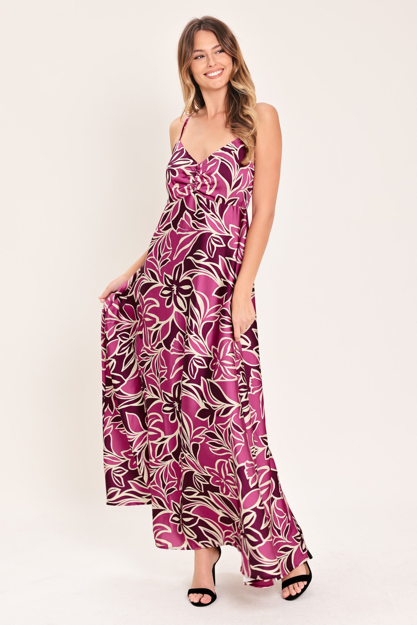 Woman wearing a pink and berry colored tropical floral maxi dress | Flying Tomato