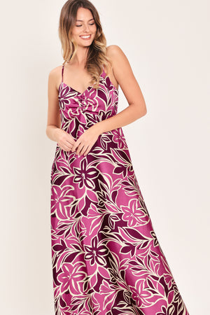Woman wearing a pink and berry colored tropical floral maxi dress | Flying Tomato