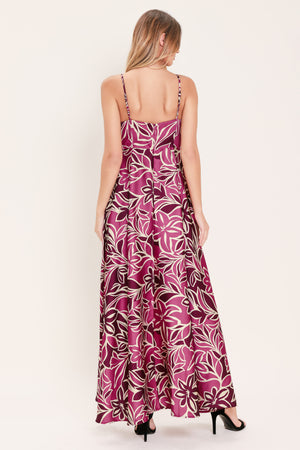 Woman wearing a pink and berry colored tropical floral maxi dress | Flying Tomato