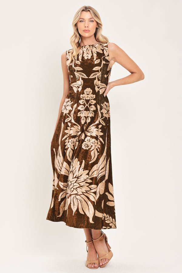 A woman modeling a sleeveless brown velvet midi dress with a large beige floral pattern | Flying Tomato