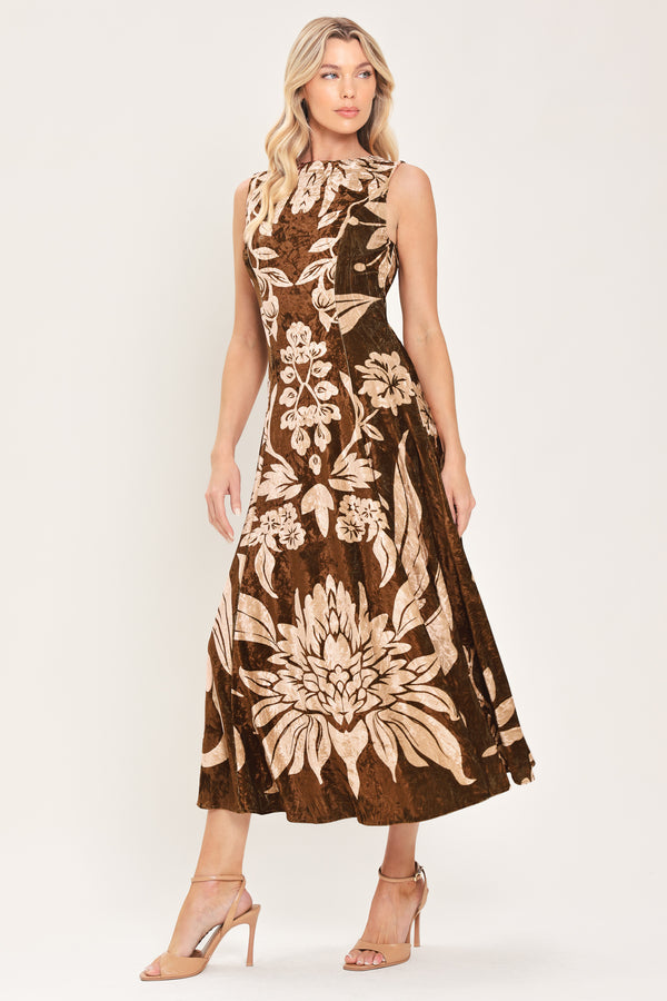A woman modeling a sleeveless brown velvet midi dress with a large beige floral pattern | Flying Tomato