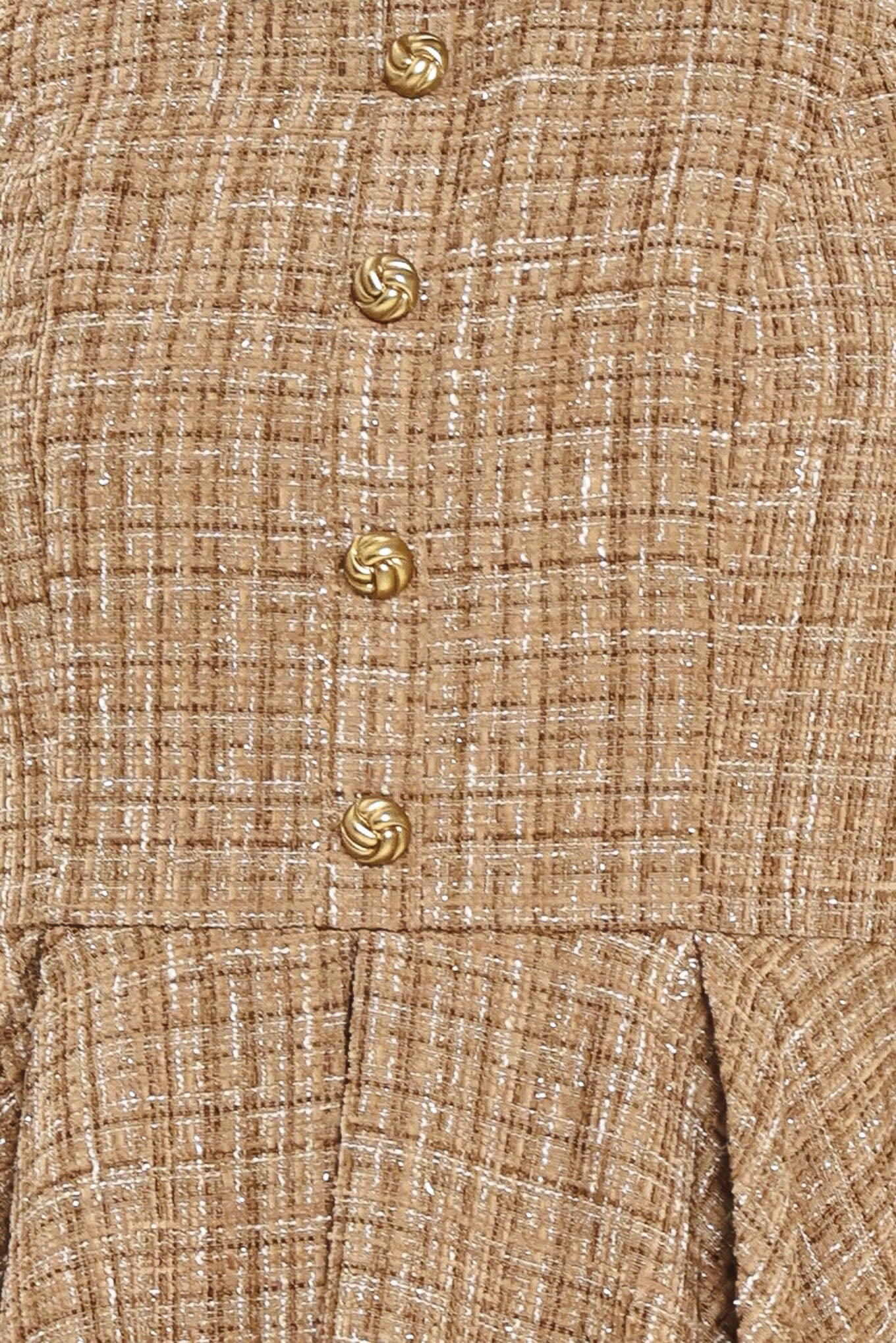 Woman wearing a hazel tweed mini dress featuring halter neckline with white collar finish, front button detail, full circle skirt and back zipper closure background | Flying Tomato