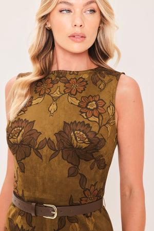 A woman modeling a sleeveless fit-and-flare mini dress with a brown and olive green floral damask pattern and a matching brown belt | Flying Tomato
