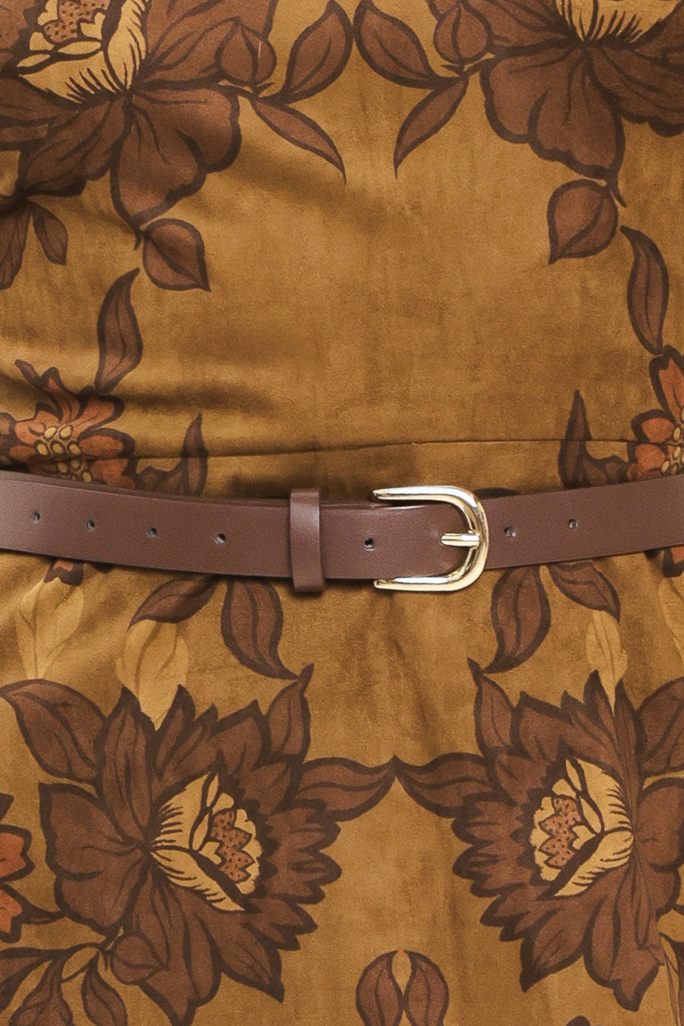 A woman modeling a sleeveless fit-and-flare mini dress with a brown and olive green floral damask pattern and a matching brown belt | Flying Tomato