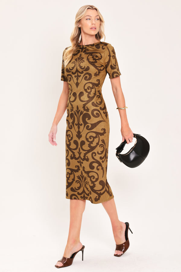 A woman modeling a short-sleeve faux suede camel midi dress with a brown damask pattern | Flying Tomato
