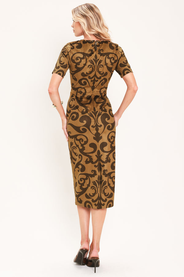 A woman modeling a short-sleeve faux suede camel midi dress with a brown damask pattern | Flying Tomato