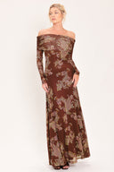 An off-the-shoulder long-sleeve maxi dress in dark brown with an intricate paisley and floral pattern in beige, gold, and muted green | Flying Tomato