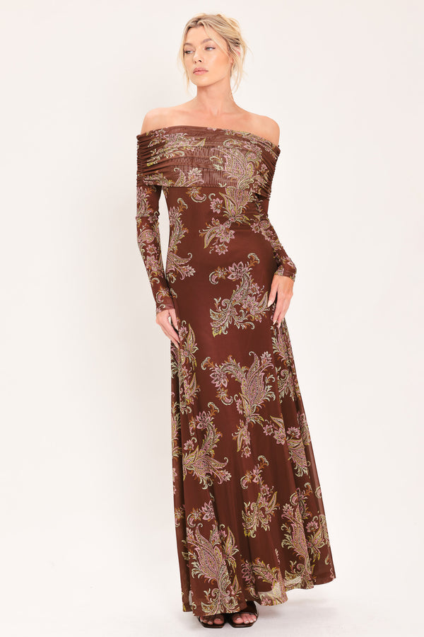 An off-the-shoulder long-sleeve maxi dress in dark brown with an intricate paisley and floral pattern in beige, gold, and muted green | Flying Tomato