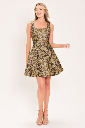A woman modeling a sleeveless fit-and-flare dress with a brown, gold, and beige floral jacquard pattern | Flying Tomato