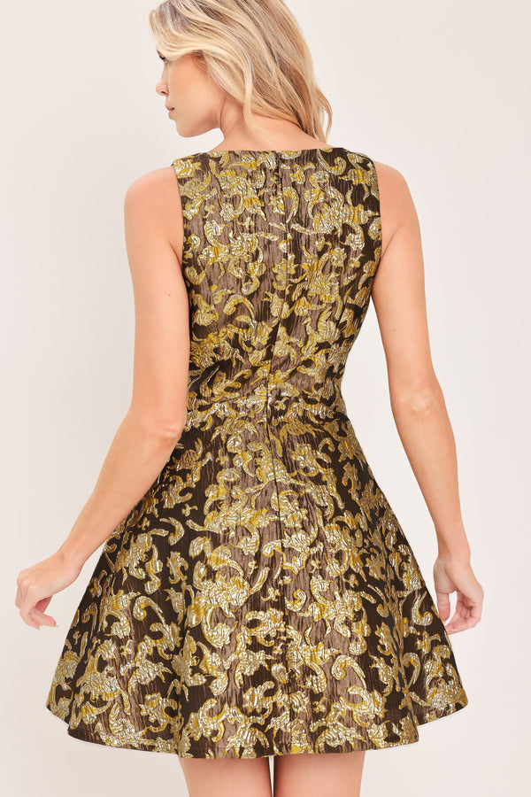 A woman modeling a sleeveless fit-and-flare dress with a brown, gold, and beige floral jacquard pattern | Flying Tomato