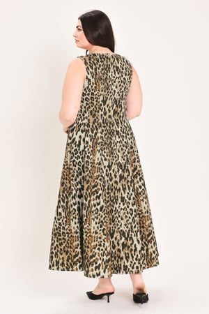A woman modeling a sleeveless leopard-print midi dress with a structured bodice and flared skirt, paired with black pointed-toe heels, against a plain light background | FREEMARKET Curve