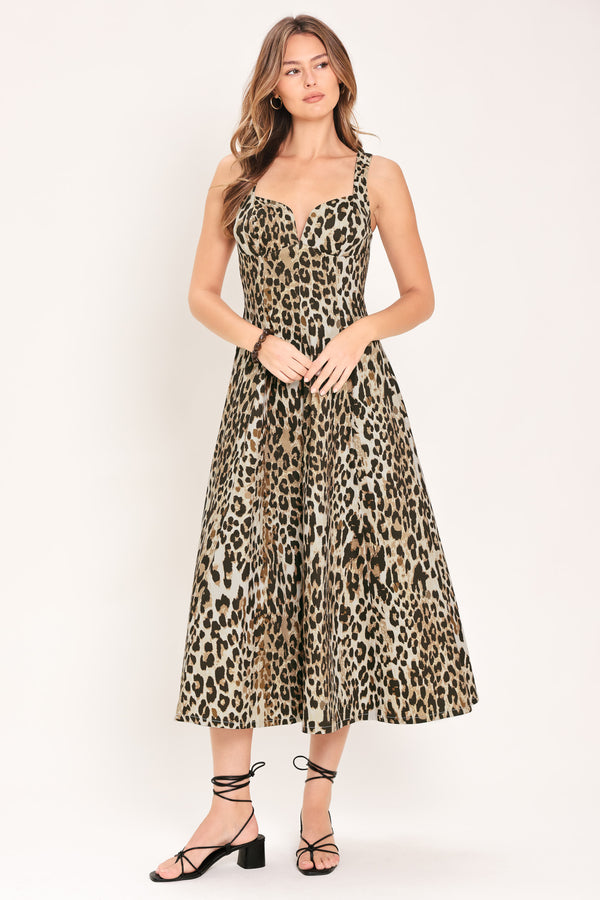 Woman wearing a sleeveless leopard print midi dress featuring sweetheart neckline, circle skirt and back zipper closure | Flying Tomato