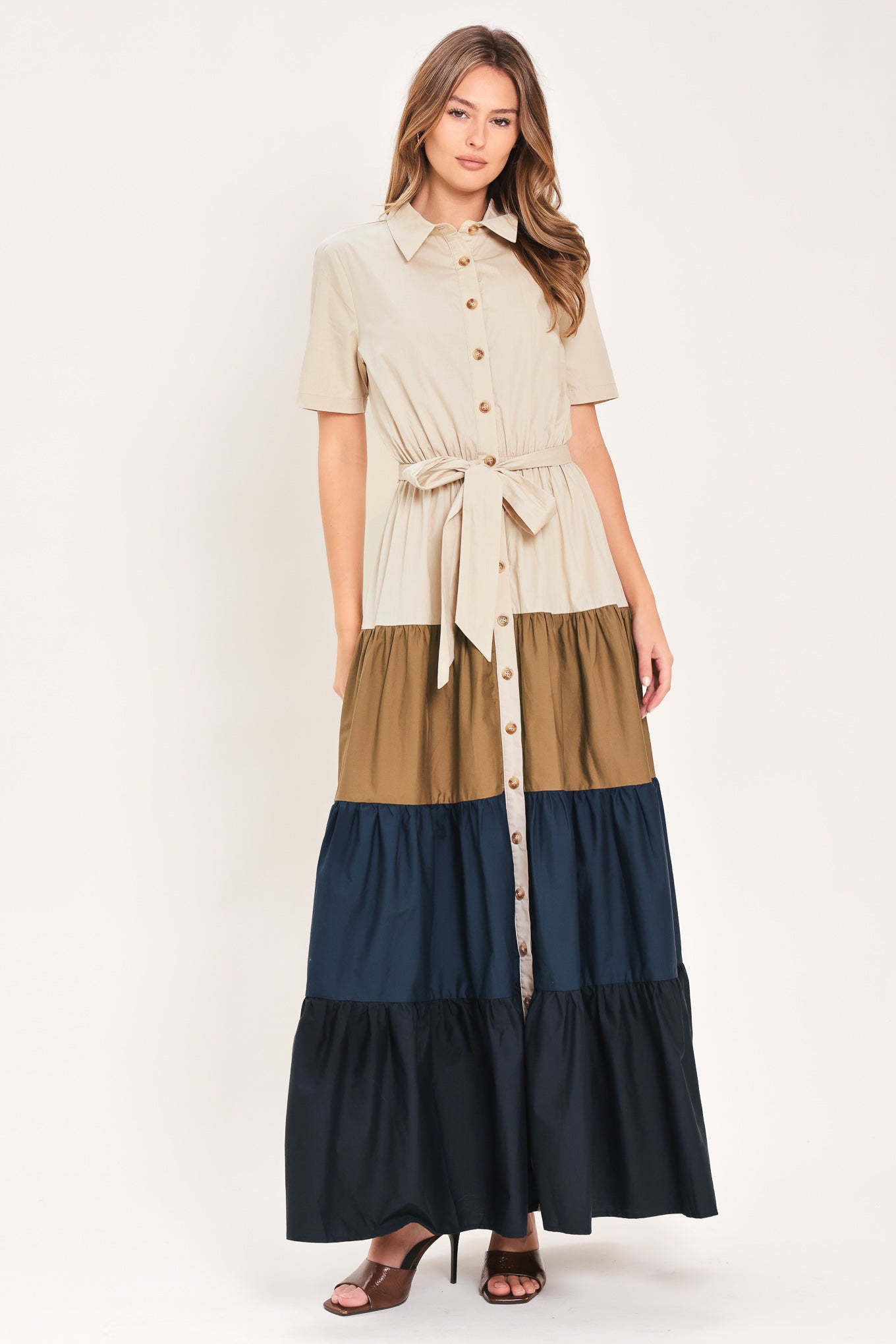 Woman wearing a color-blocked midi dress with beige, brown, and navy | Flying Tomato