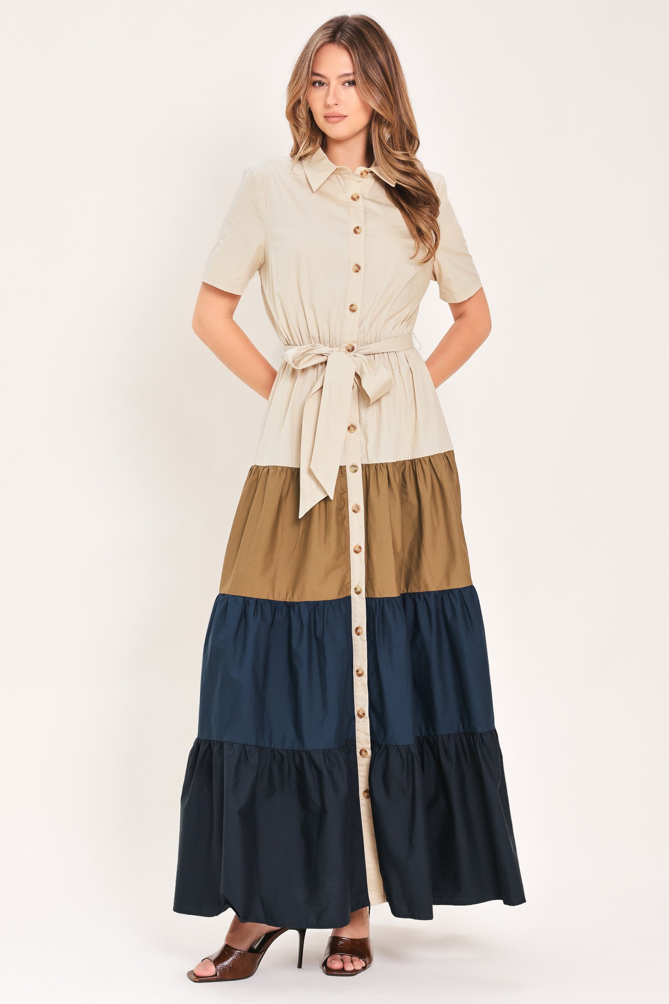 Woman wearing a color-blocked midi dress with beige, brown, and navy | Flying Tomato