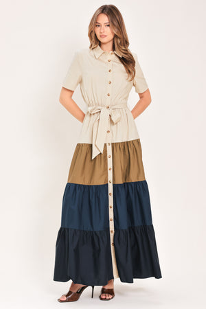 Woman wearing a color-blocked midi dress with beige, brown, and navy | Flying Tomato
