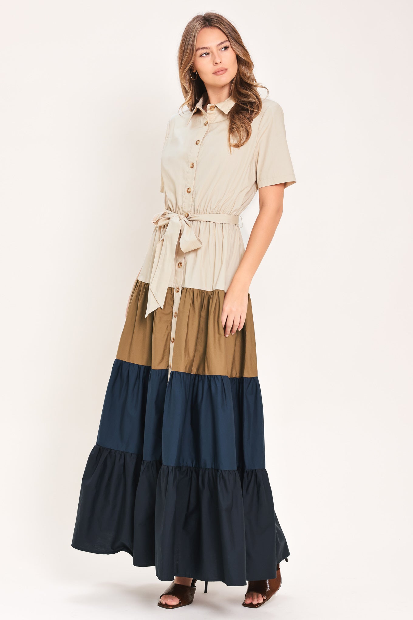 Woman wearing a color-blocked midi dress with beige, brown, and navy | Flying Tomato