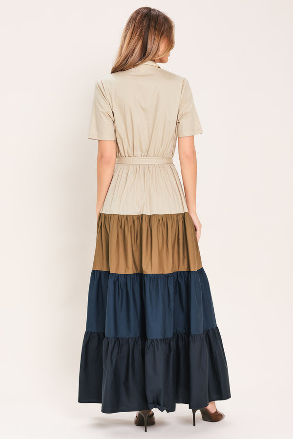 Woman wearing a color-blocked midi dress with beige, brown, and navy | Flying Tomato