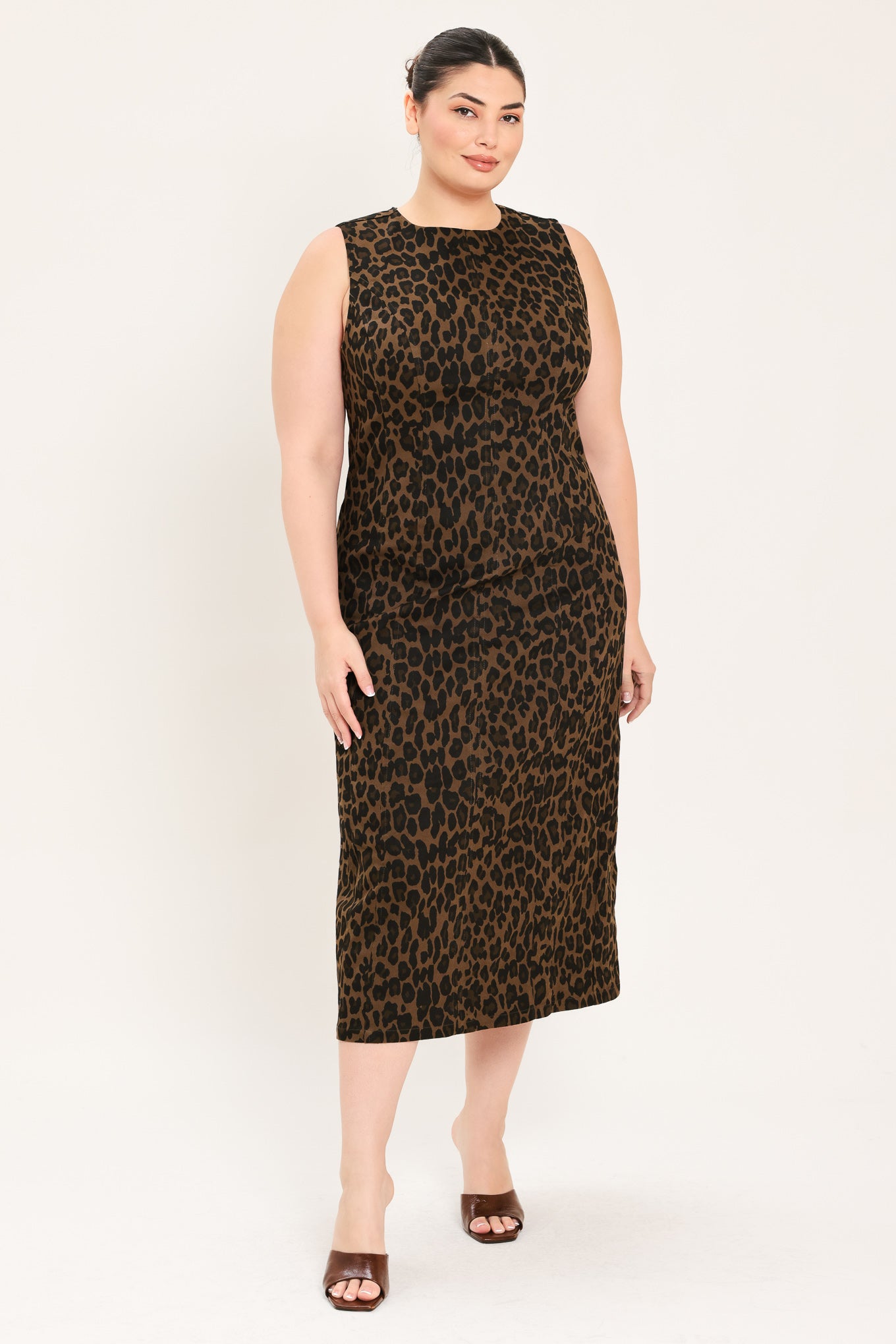 A woman modeling a sleeveless, midi leopard print dress in brown and black |Plus Curve Flying Tomato