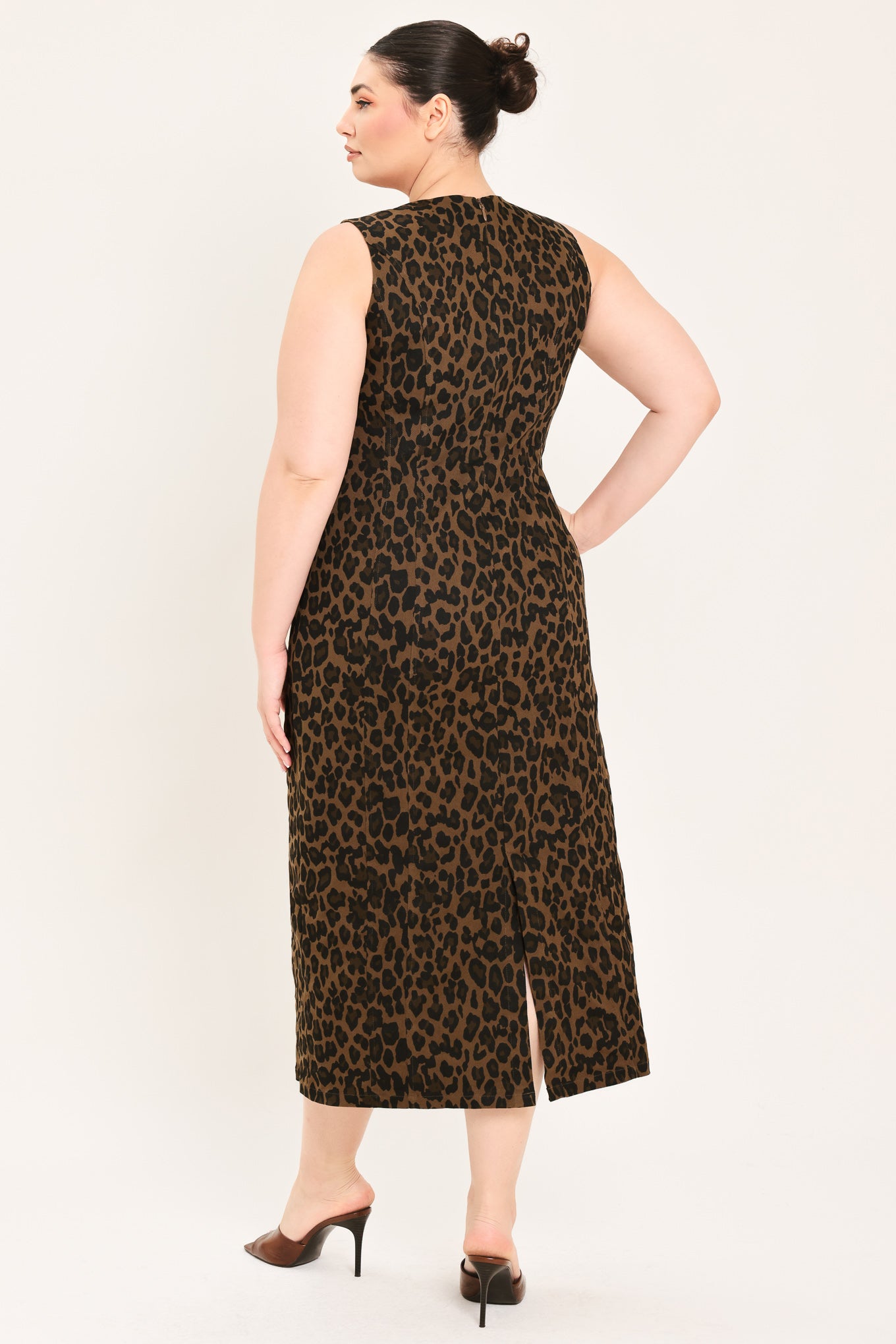 A woman modeling a sleeveless, midi leopard print dress in brown and black |Plus Curve Flying Tomato