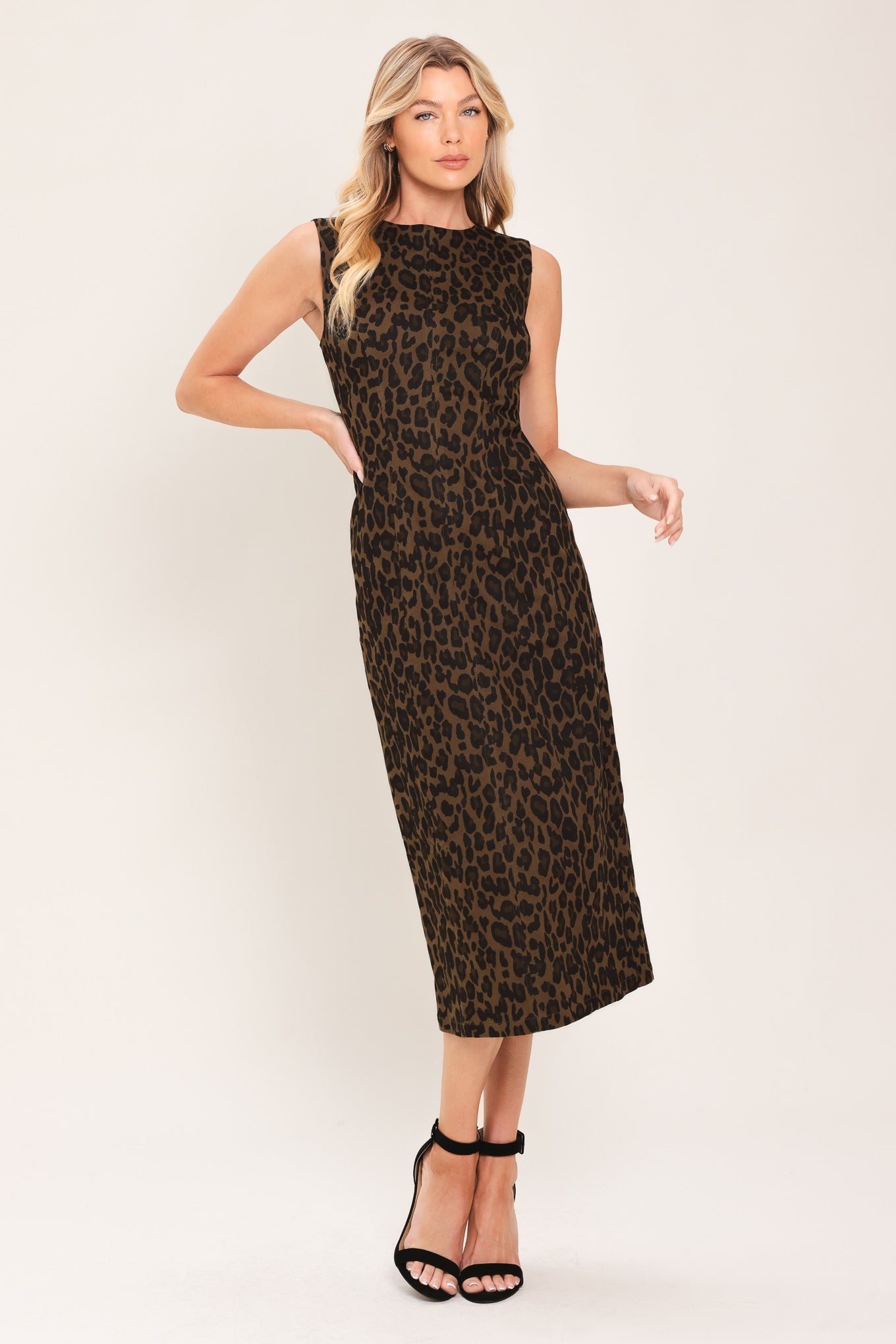 Woman wearing a brown and black leopard print twill midi dress with round neckline, sleeveless, back slit and zipper closure | Flying Tomato