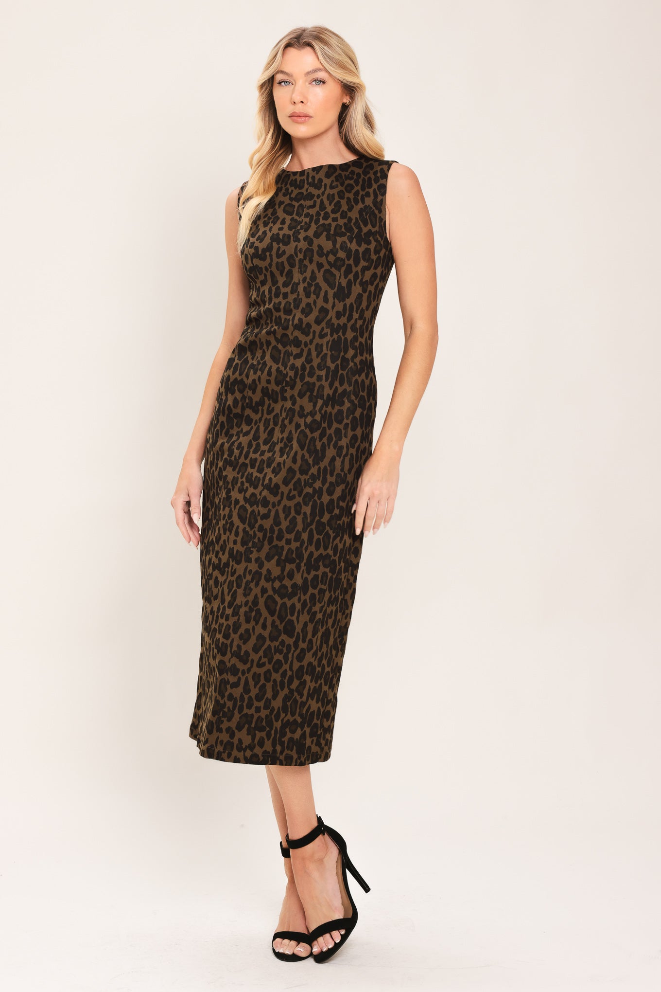 Woman wearing a brown and black leopard print twill midi dress with round neckline, sleeveless, back slit and zipper closure | Flying Tomato