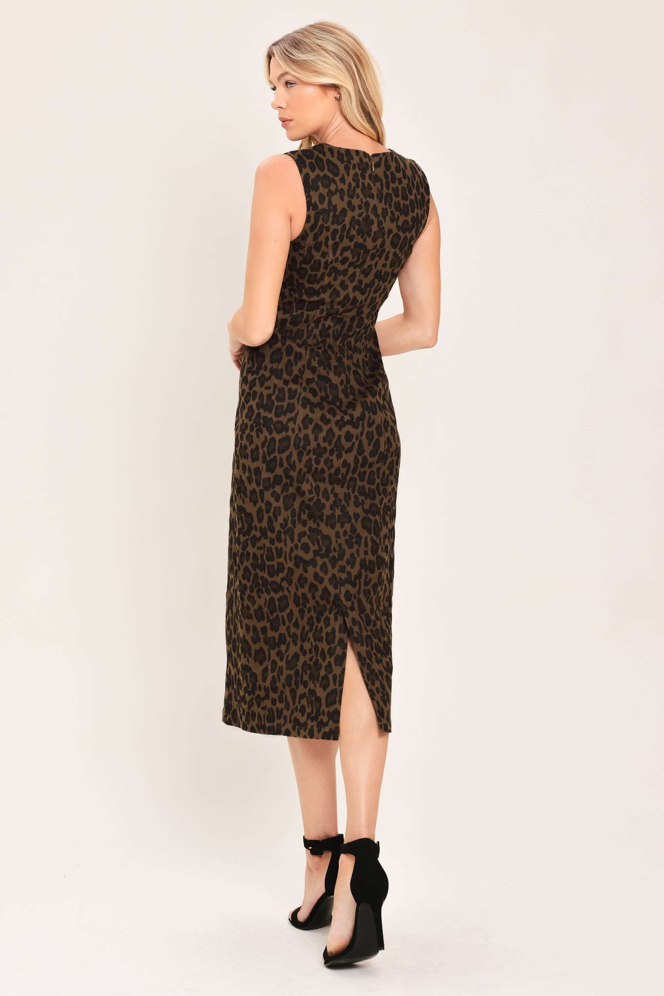 Woman wearing a brown and black leopard print twill midi dress with round neckline, sleeveless, back slit and zipper closure | Flying Tomato
