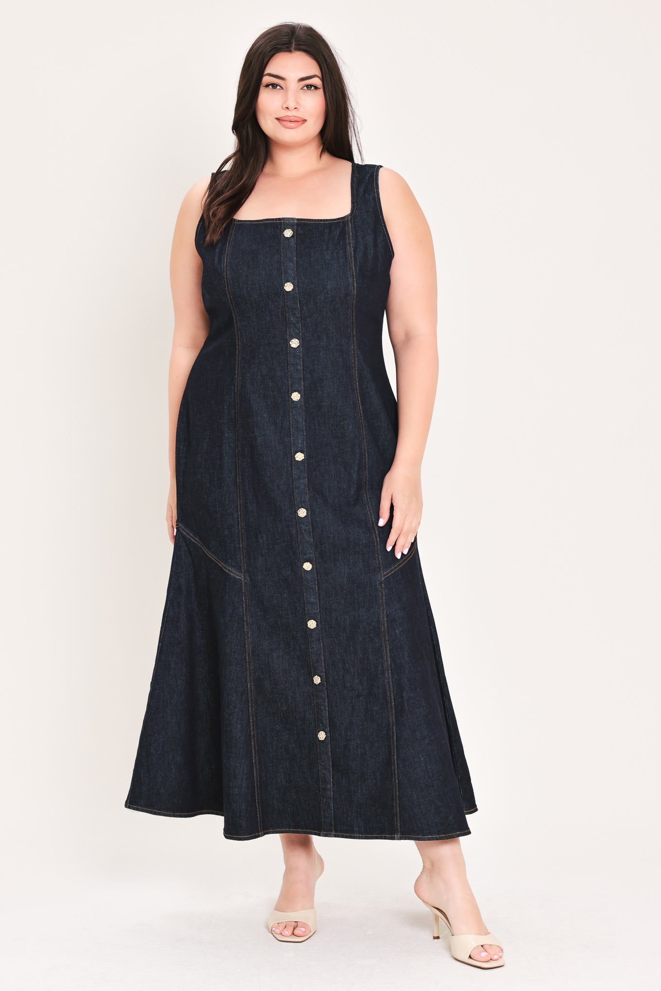 Woman wearing a dark denim dress with buttons on a white background | Flying Tomato Curve