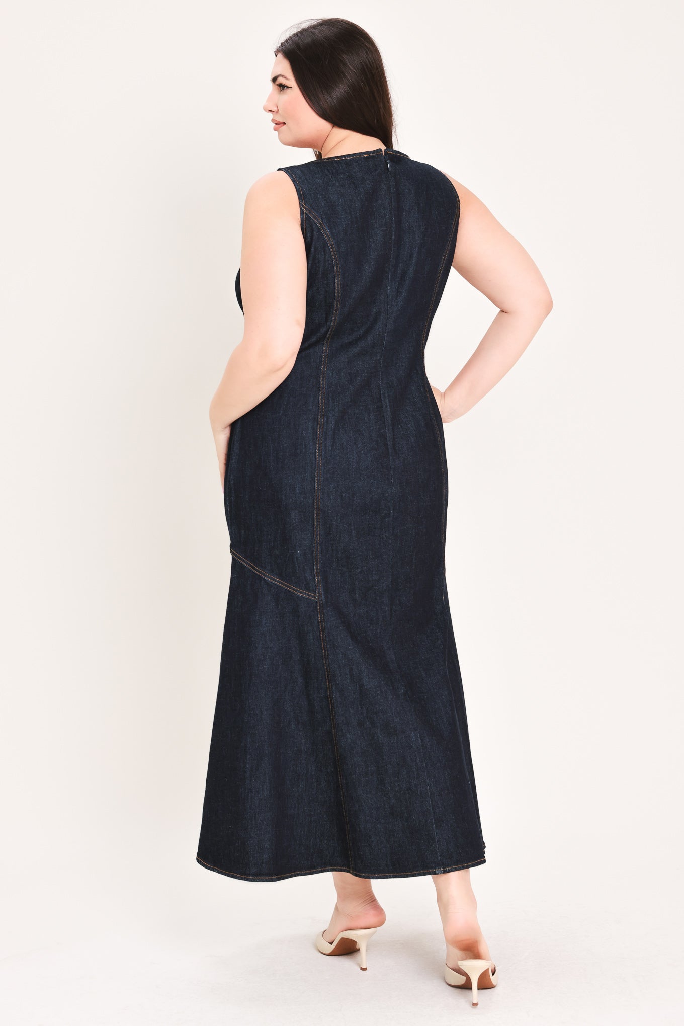Woman wearing a dark denim dress with buttons on a white background | Flying Tomato Curve
