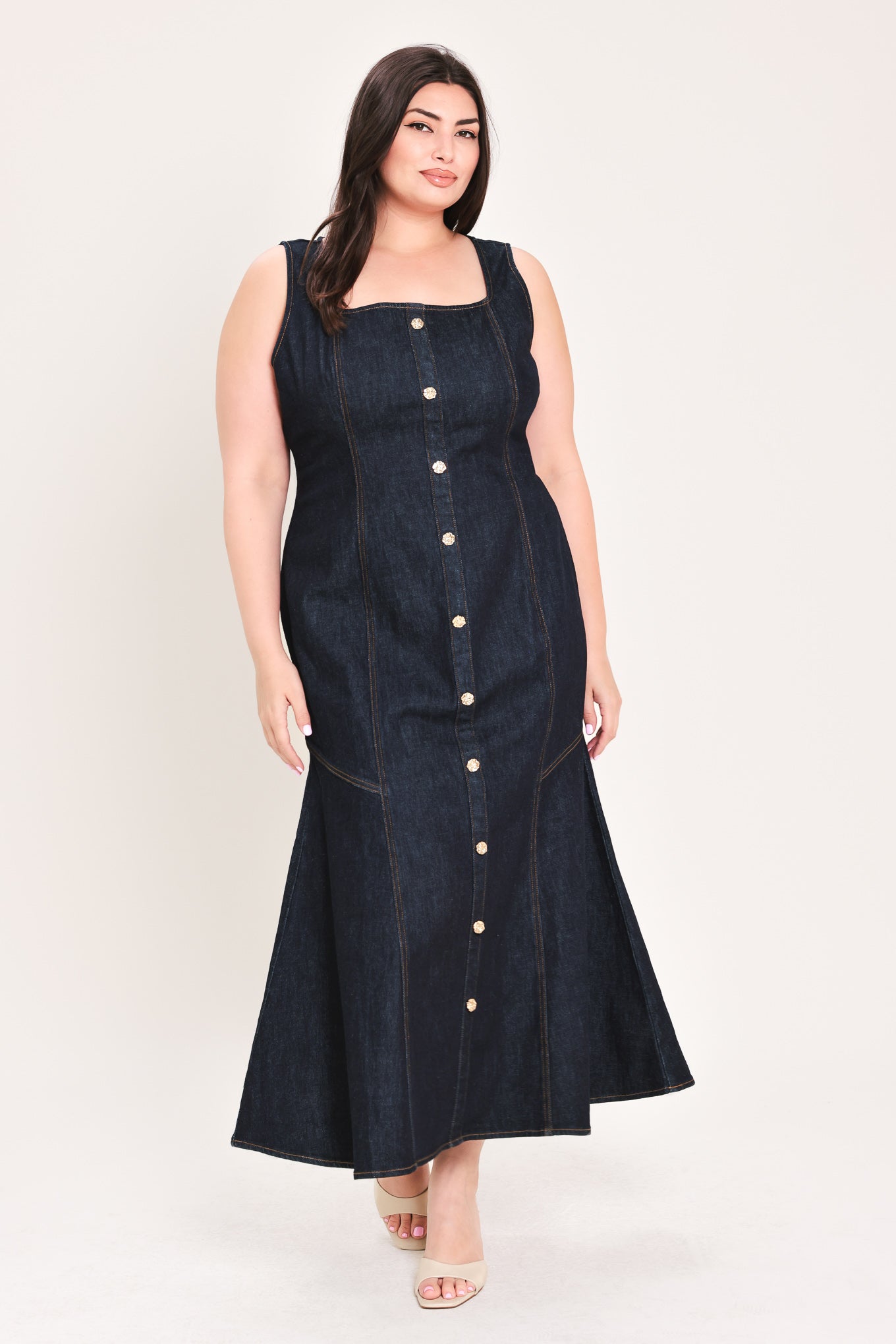 Woman wearing a dark denim dress with buttons on a white background | Flying Tomato Curve