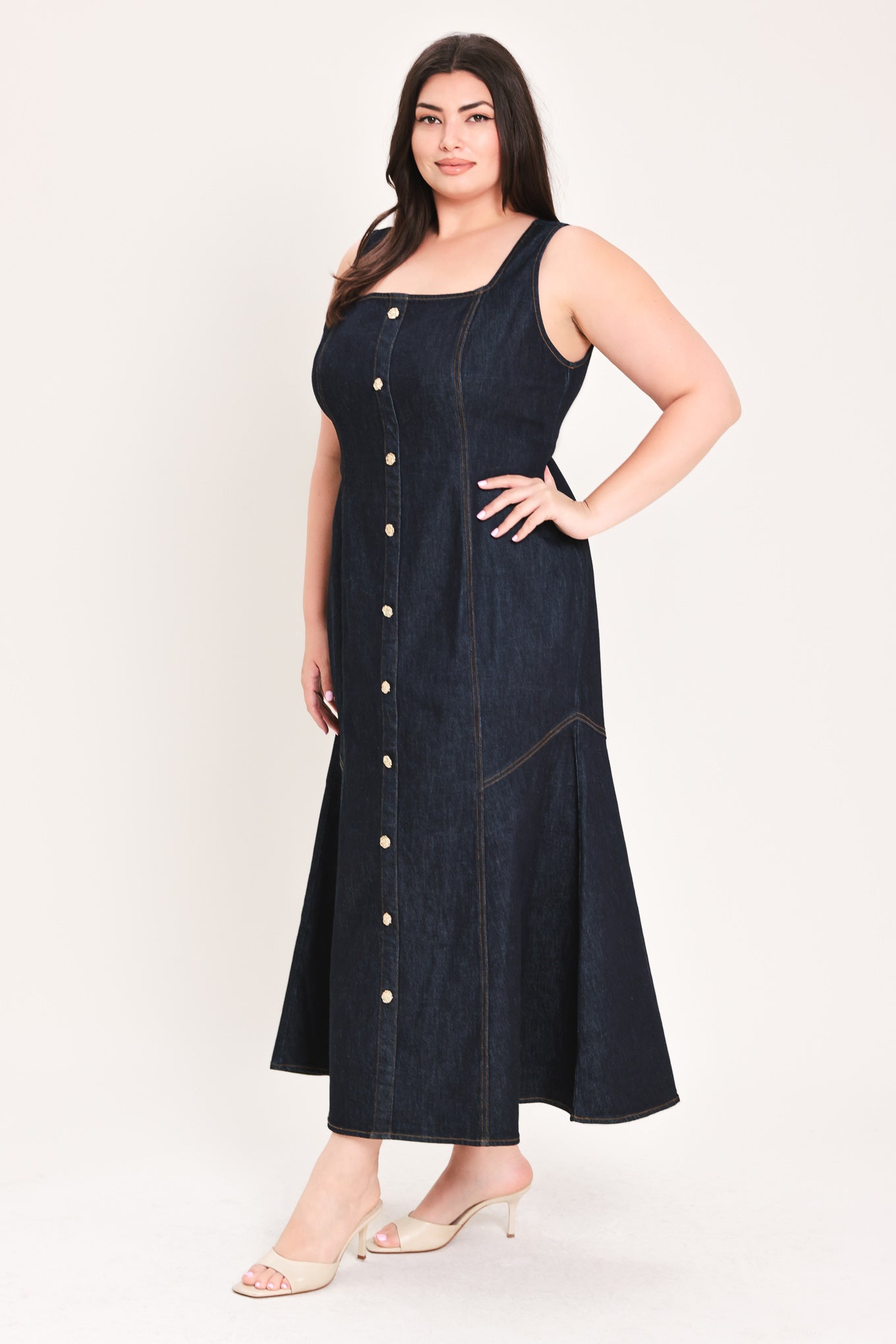 Woman wearing a dark denim dress with buttons on a white background | Flying Tomato Curve