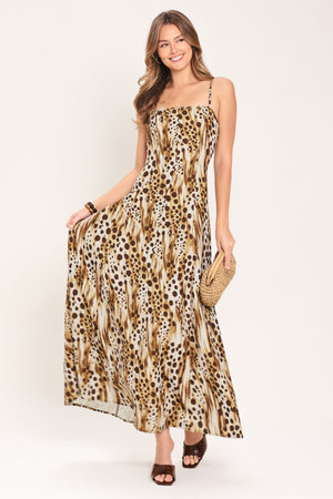 Woman wearing a leopard print maxi dress featuring straight neckline, straps and back zipper closure | Flying Tomato